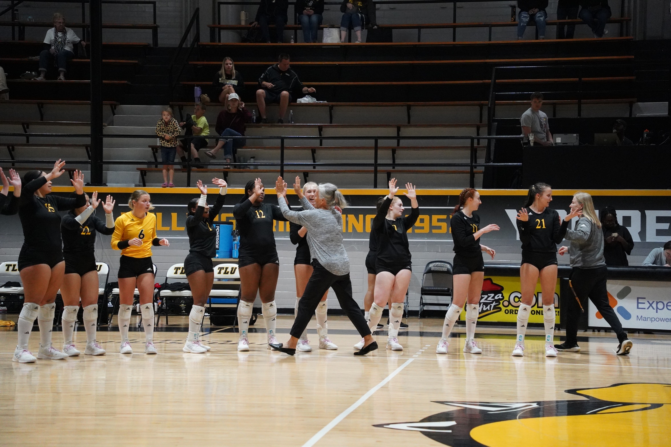 Phyllis Fowler celebrates with the team (photo by Missy Muras '25)