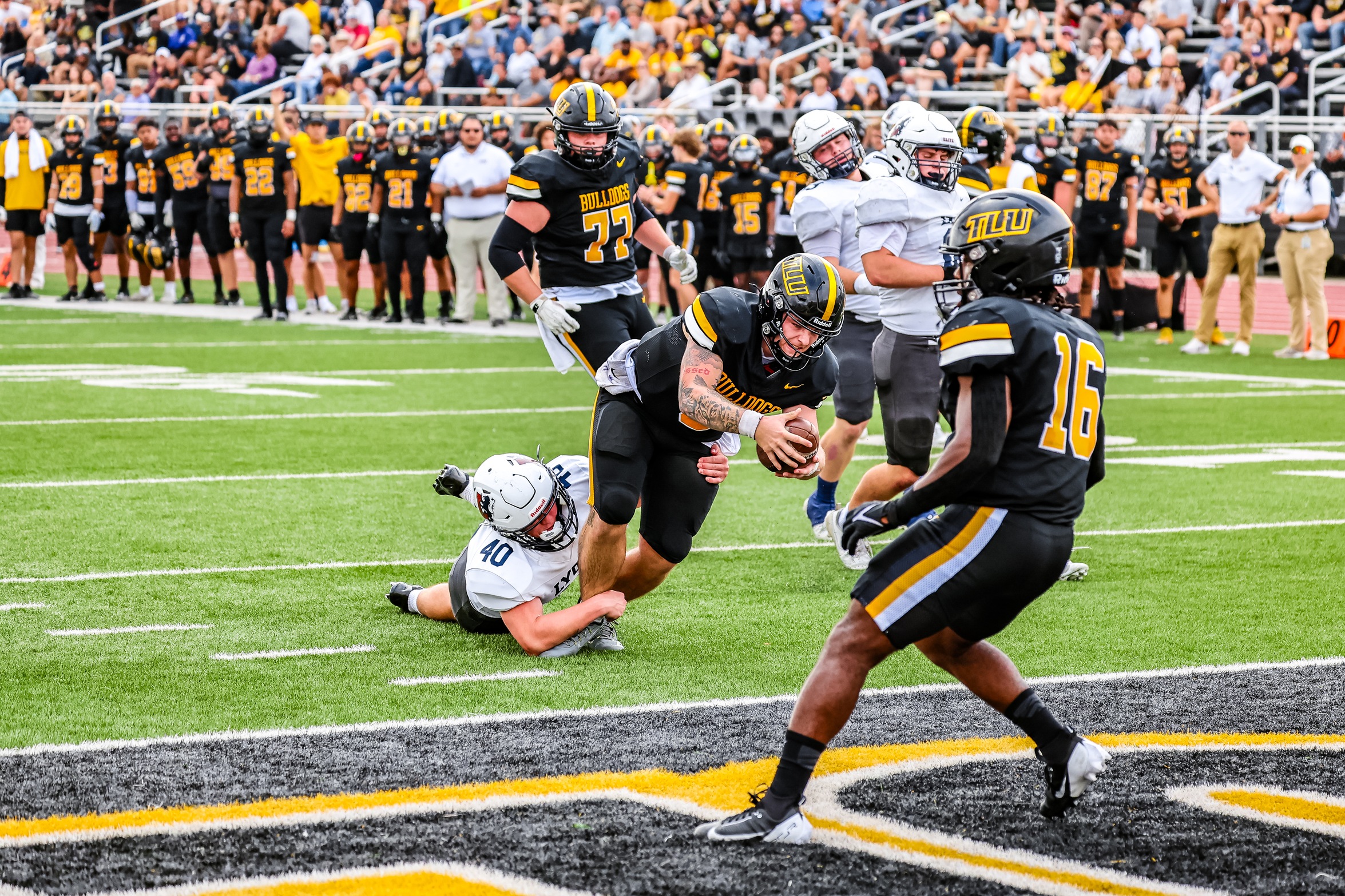 Caden Bosanko extends the ball into the end zone for a touchdown (photo by Dustin Wyatt)