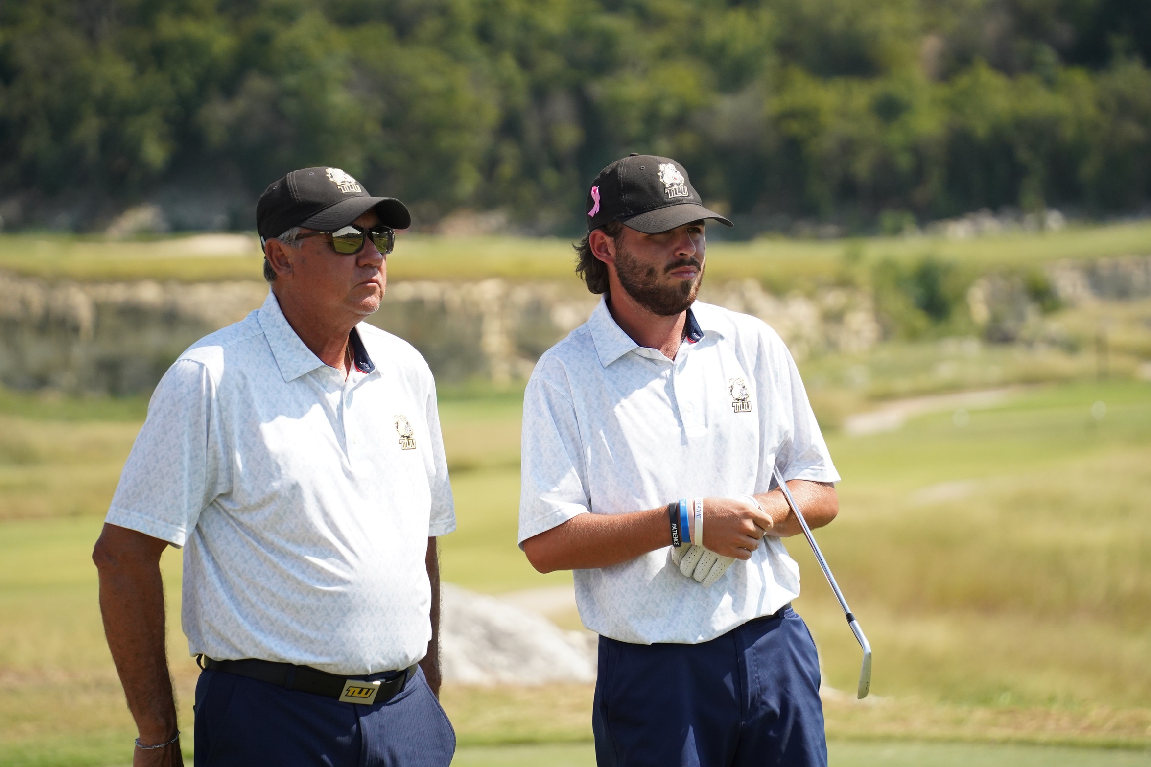 Tyler Givilancz (right) and TLU golf head coach, HC Tran (photo by Bryce Hayes)