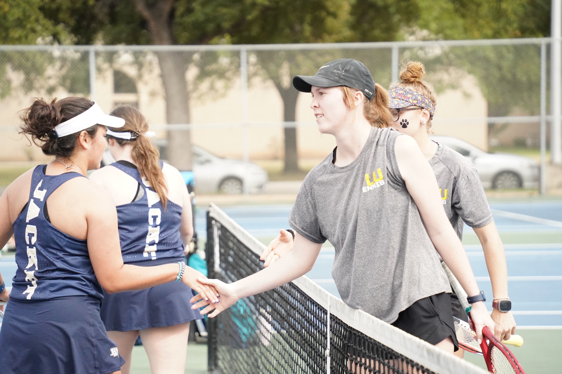 Allie Speyrer shakes hands with Howard Payne (photo by Bryce Hayes)