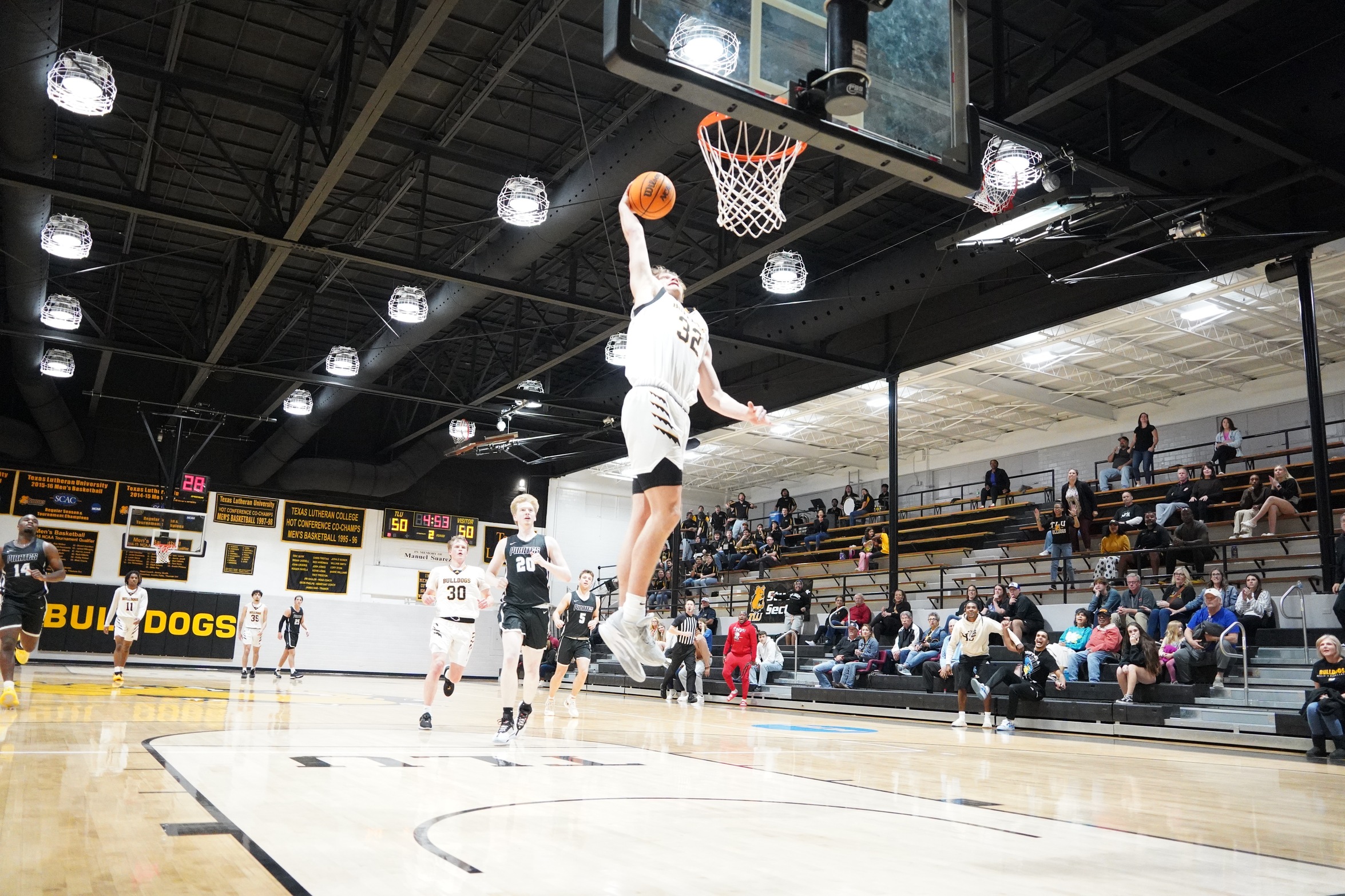 Teddy Tapken goes up for a dunk (Photo by Callie Brame '25)